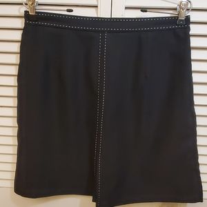 Izod black golf skort with white stitching